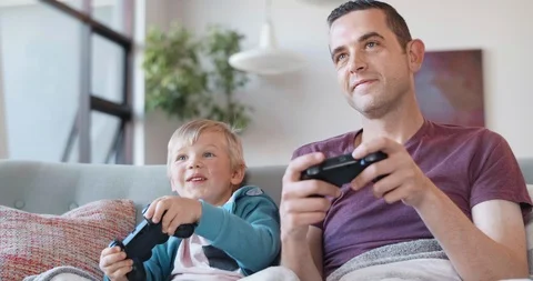 Father and son playing computer games Stock Footage 120346679