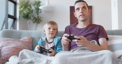 Father and son playing computer games Stock Footage 120348300
