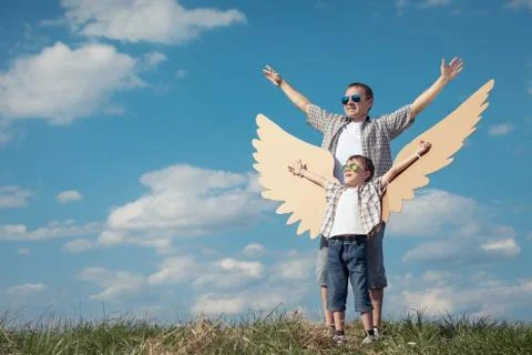 Father and son playing on the field at the day time. Foto stock