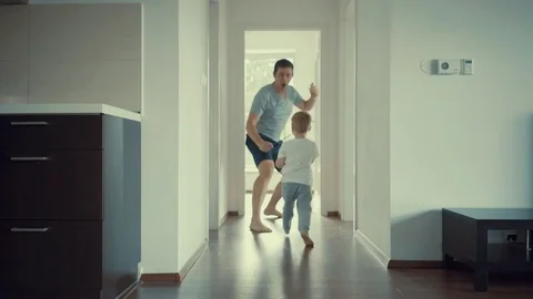 Father and son playing at home Видео 80216956