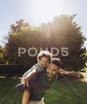 Father and son playing in the park Stock Photos