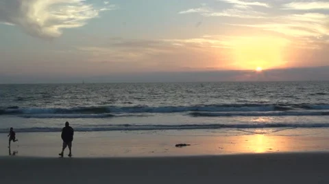 Father and son playing on sunset beach Stock Footage 49044094