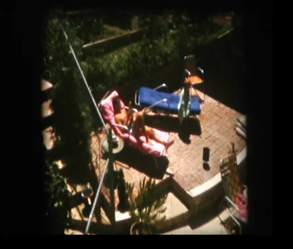 Father and son on pool deck Stock Footage 33866789