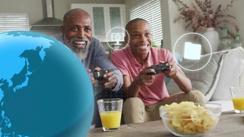 Father and son pressing controllers, starting gaming UI globe and icons Stock Footage 333210944