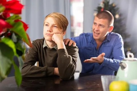 Father and son quarrel while celebrating christmas in home 스톡 사진