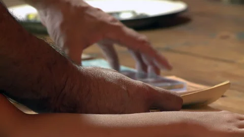 Father and Son Reading a Book at the Table in their Home in a Rural House. Stock Footage 276103255