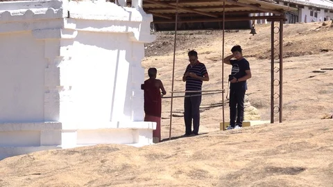 Father and son receiving blessing from priest Stock Footage 87664044