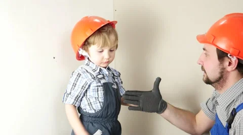Father and son shake hands. Stock Footage 58953106