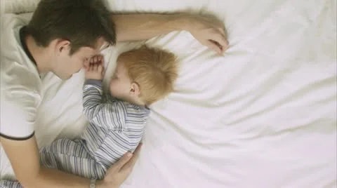 Father and son sleeping Stock Footage 11283737