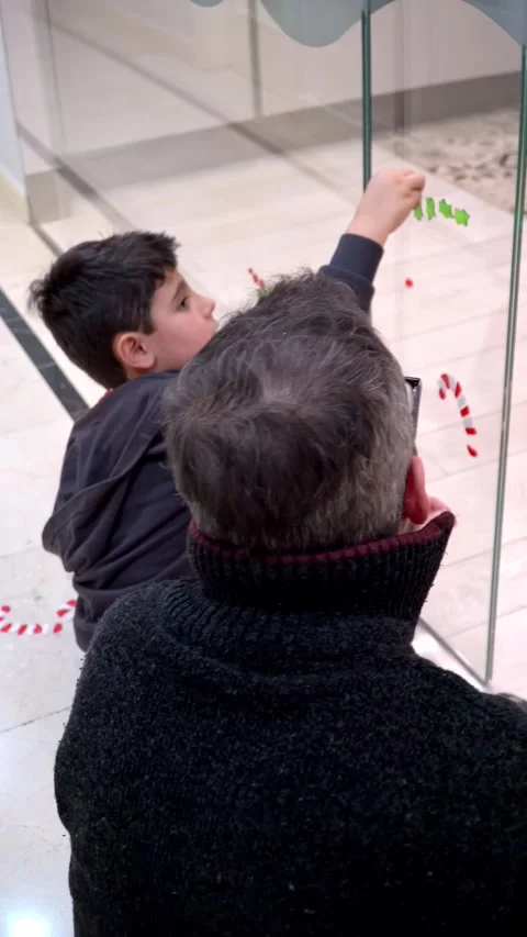 Father and son spending quality time together doing christmas crafts Stock Footage 345253812