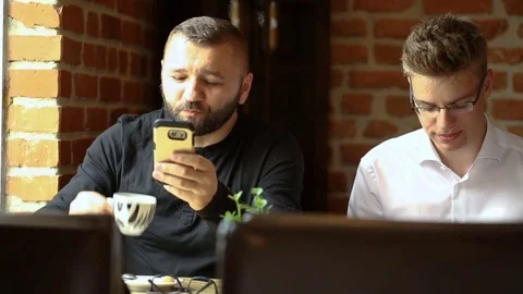 Father and son spending time together in the cafe Stock Footage 80424668