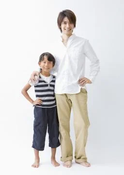 Father and son standing side by side Stock Photos