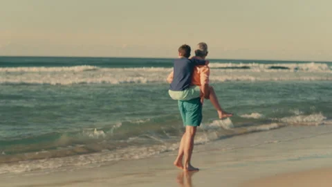 Father and son time at the beach Stock Footage 262393256