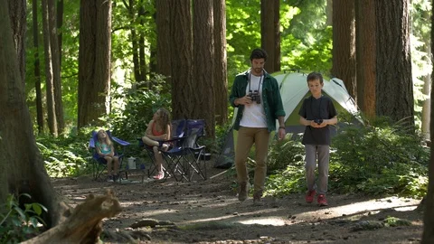 Father and son using binoculars in the woods Stock-Footage 88011760