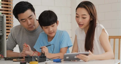 Father and son using computer together at home. Stock Footage 122920767