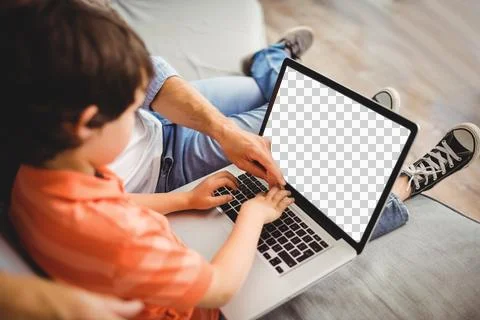 Father and son using computer together Stock Photos