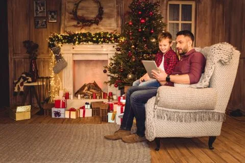 Father and son using digital tablet Stock Photos