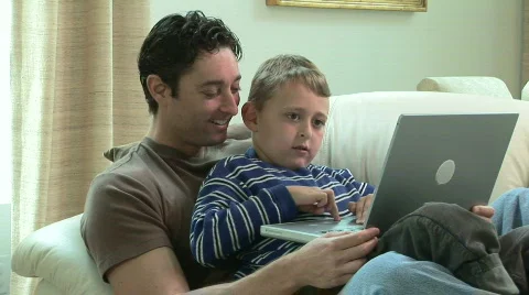 Father and son using laptop. Видео 827295
