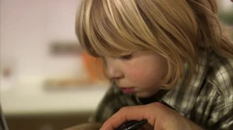 Father and son using a laptop, Stockholm Stock Footage 11298512