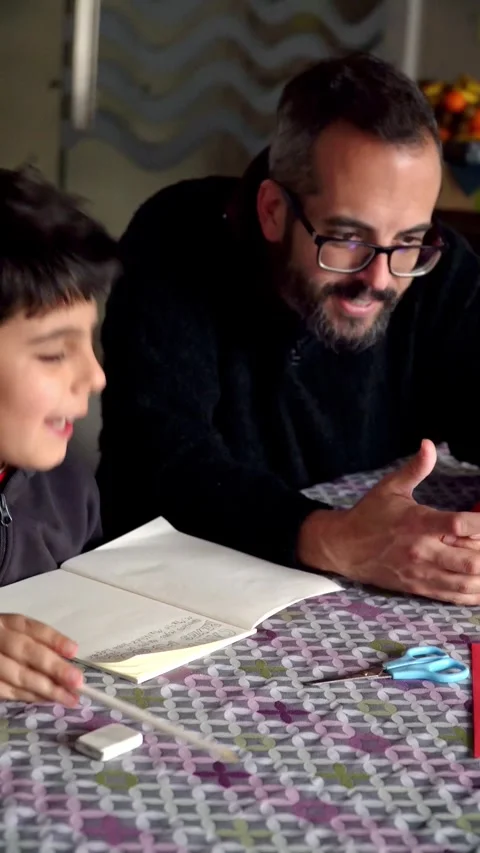 Father and son using smartphone to write the Christmas wish list Video stock 345253897