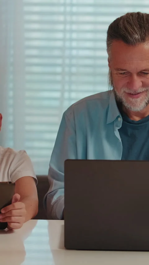 Father and Son Using Technology at Home Stock Footage 334623154