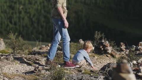 Father and son walk by the hands in the open air. concept of trust and love Stockbeeldmateriaal 105558091
