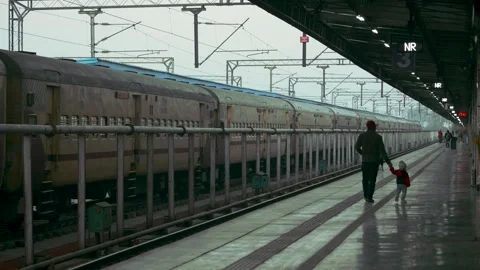 Father and Son Walking Together on Railway Station Platform in India Stock Footage 328653666