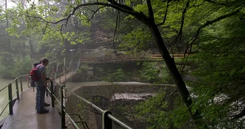 Father and son watching waterfall at Rappenlochschlucht Dornbirn Stock Footage 79057125