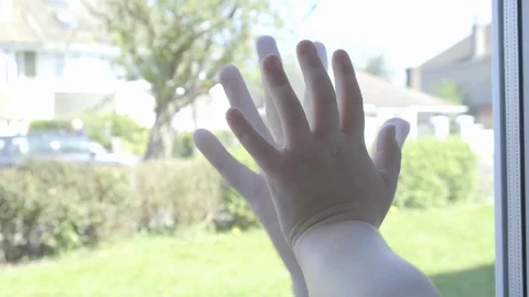 Father and son`s hands separated by glass Video stock 128720911
