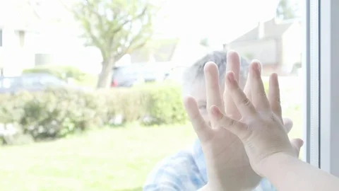 Father and son`s hands separated by glass 스톡 동영상 129045923