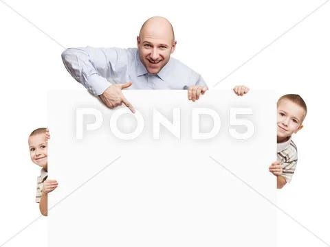 Father and sons holding blank sign or placard Stock Photos