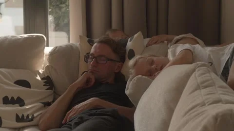 Father and Two Daughters Sleeping Peacefully Together on Sofa at Home 스톡 동영상 309007481