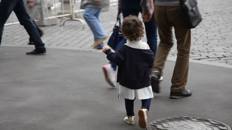 Father and two daughters walking the street Stock Footage 36901899