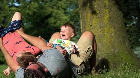 Father and two sons  having fun  Stock Footage 79976289