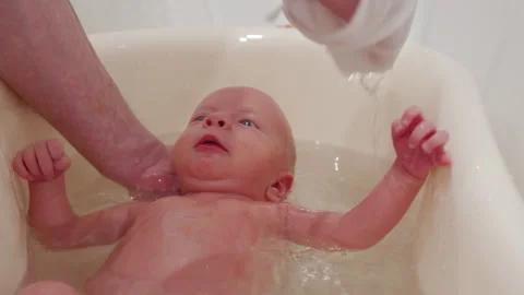 Father Bathing Newborn Baby In A Baby Ba Stock Video Pond5