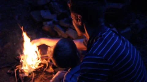 Father building a small camfire for his son Stock Footage 44446724