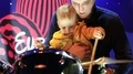 Father with child plays drums HD Footage