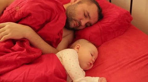 Father with child sleeps in bed Stock Footage 59777034