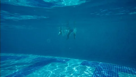 The father with the children dive into the pool Stock Footage 79743922