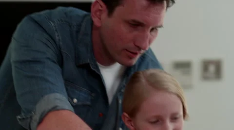 Father with children preparing pizza at kitchen. Stock Footage 64106719