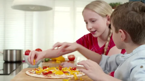Father with children preparing pizza at kitchen. Stock Footage 64106907