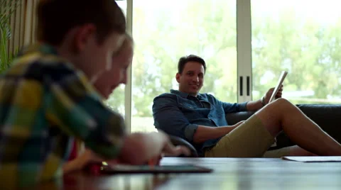 Father with children using digital tablet at home. Stock Footage 64109084