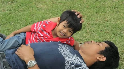 Father Cuddling With His Son 스톡 동영상 10866575