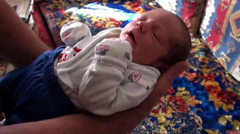 Father dandling a newborn 2 Stock Footage 33471934