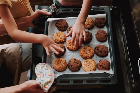 Father with daughters on kitchen Stock Photos