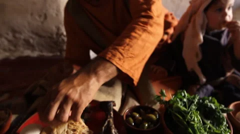 Father Eats Dinner with Son, Biblical Re-enactment Stock Footage 51683583