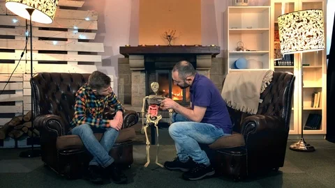 Father explaining his elder son the bone structure of human body showing on Stock Footage 113884752
