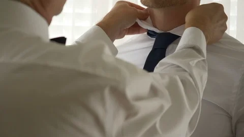 Father Fixing his son's tie Vídeo Stock 106458043