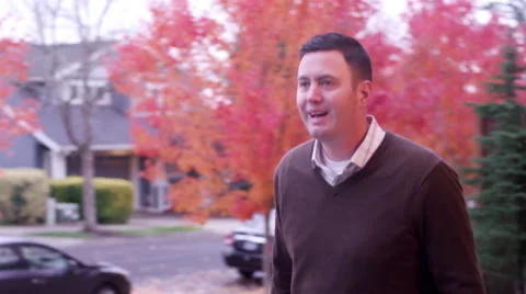 A father getting home from work gives his three kids a group hug Video stock 63218943