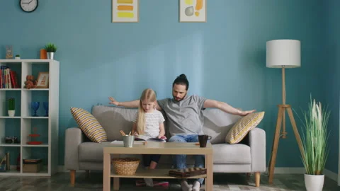Father Is Going to Read Book with His Daughter Stock Footage 133377623